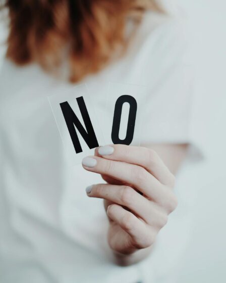 person holding letters