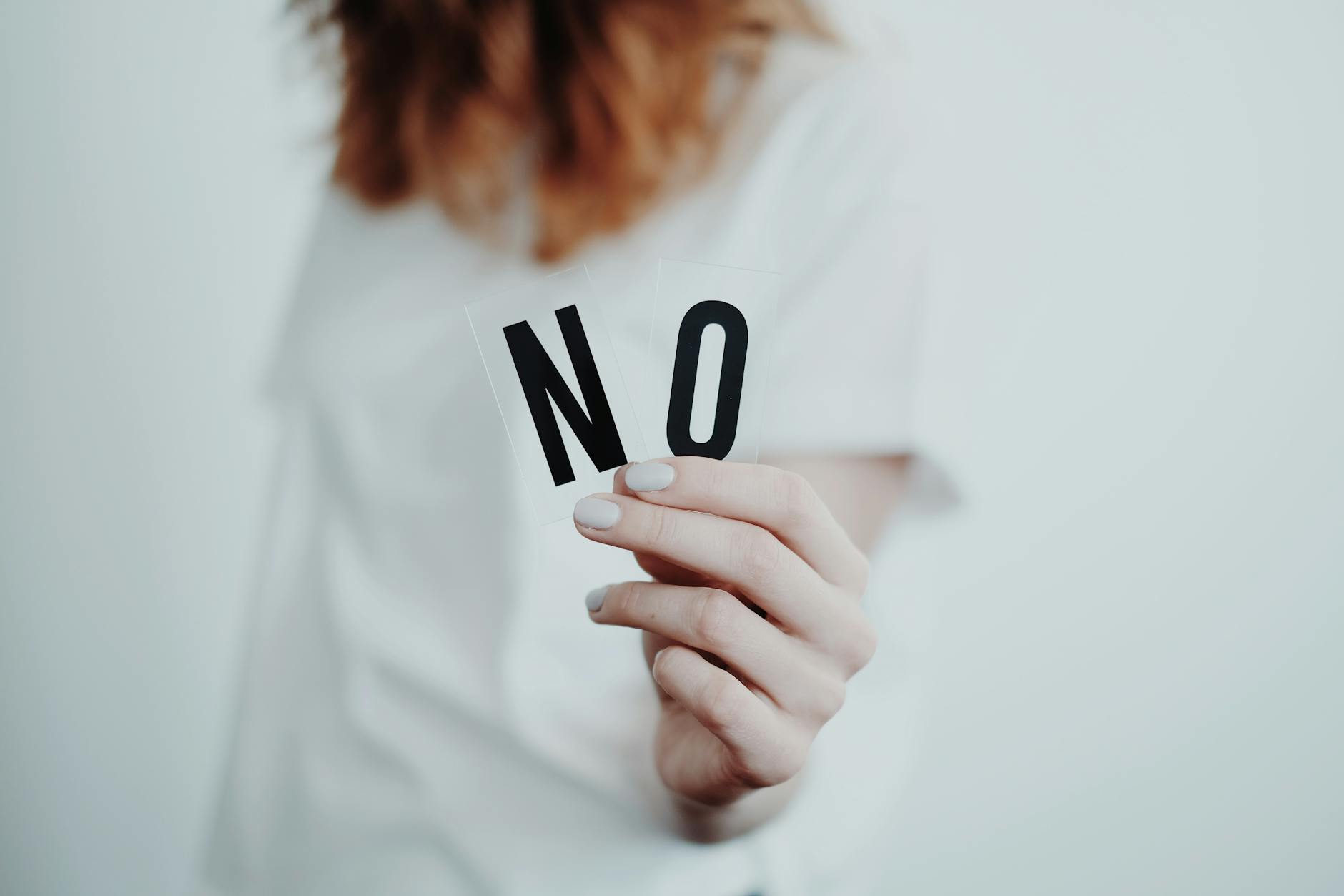 person holding letters