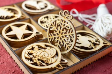 wooden christmas ornaments on a box