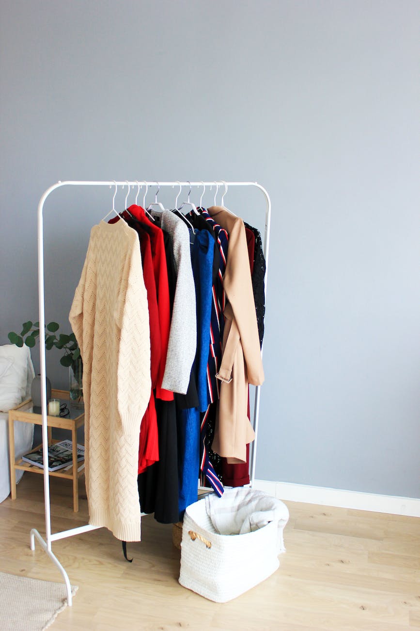 assorted colored dresses on white clothes rack