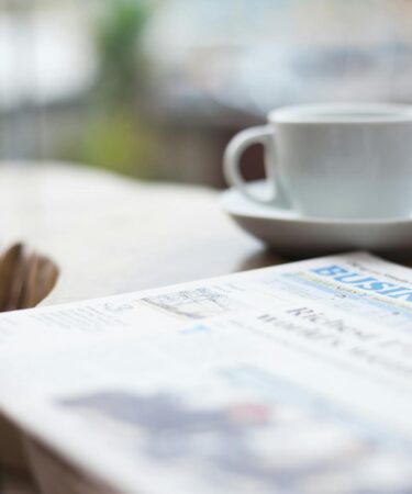 selective focus photography of business newspaper