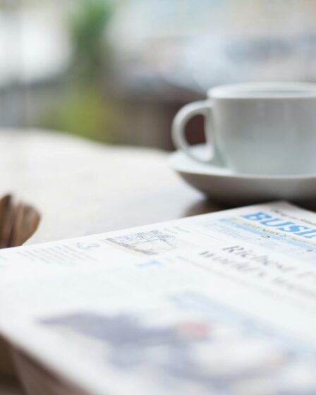 selective focus photography of business newspaper