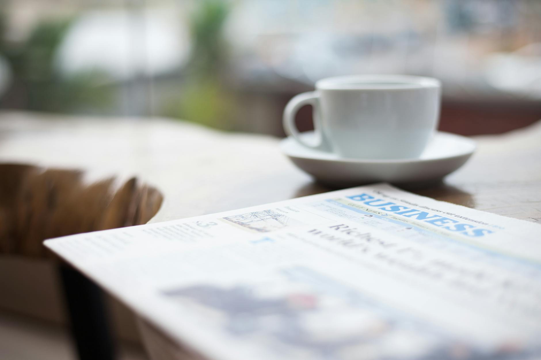 selective focus photography of business newspaper