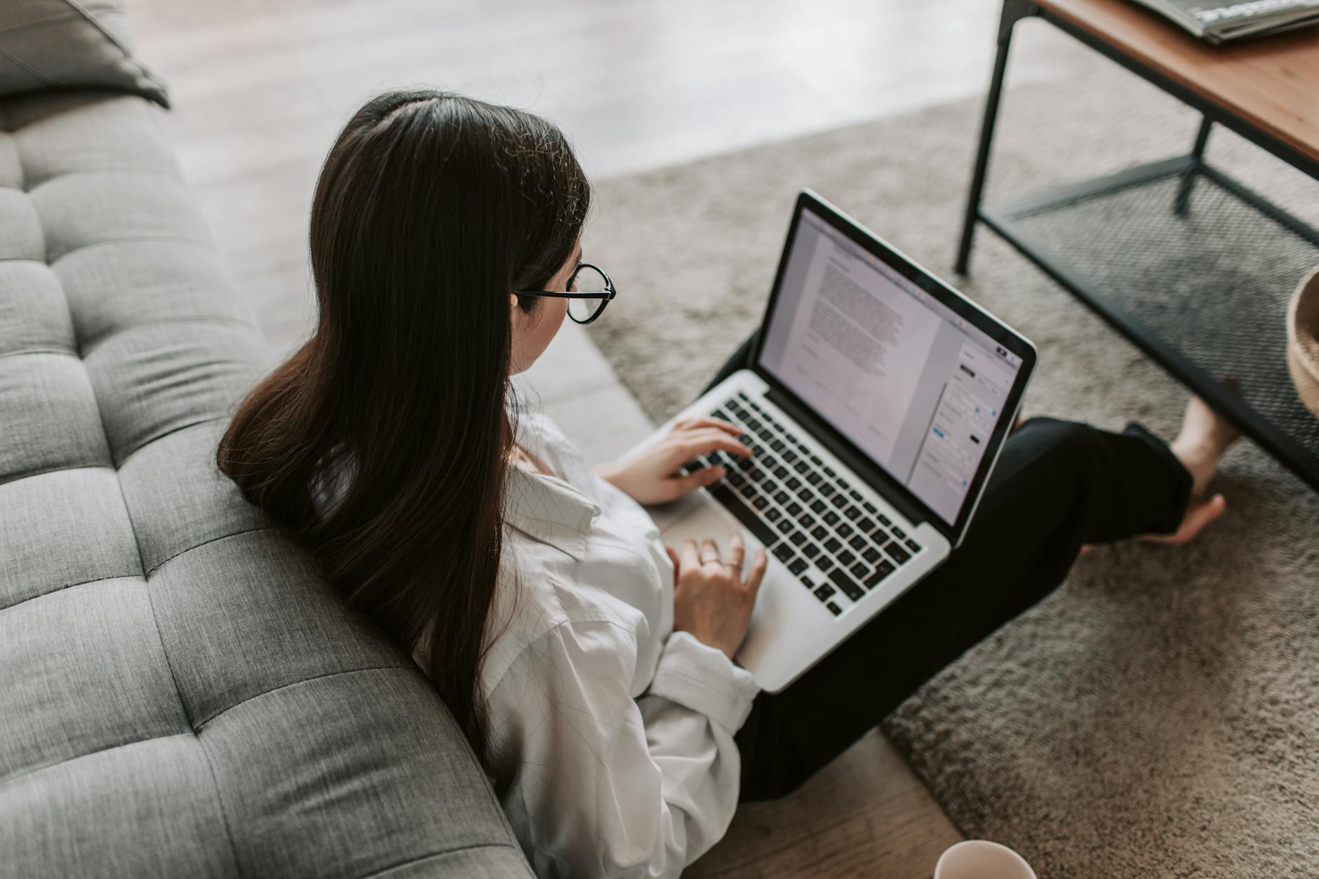 woman working at home using her laptop