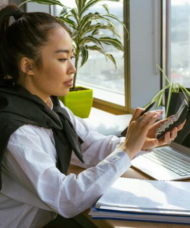 a woman computing with a calculator