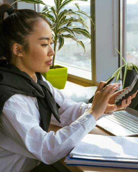 a woman computing with a calculator