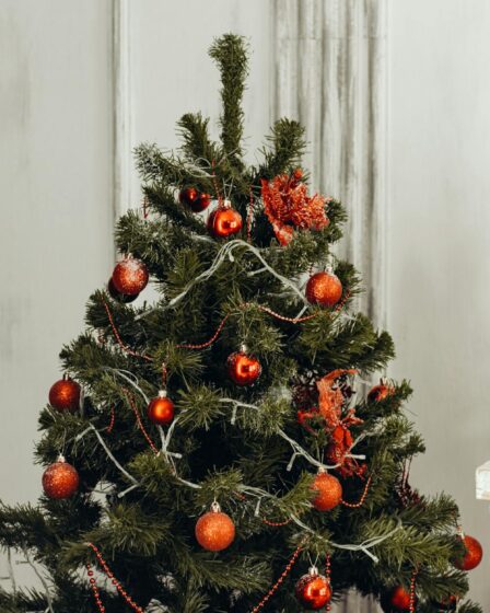 green christmas tree with orange bauble