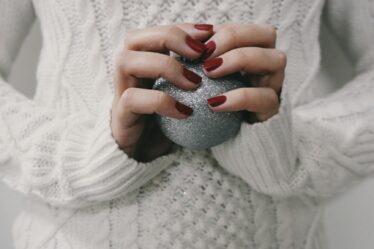 person holding gray ball