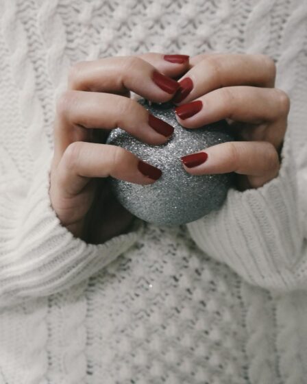 person holding gray ball