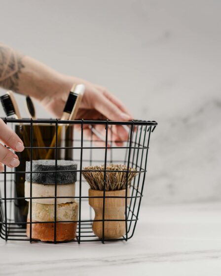 person holding stainless steel basket with brown and black metal tools