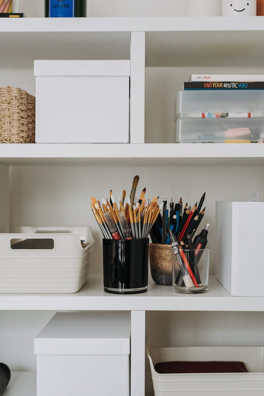 shelves with various art equipment