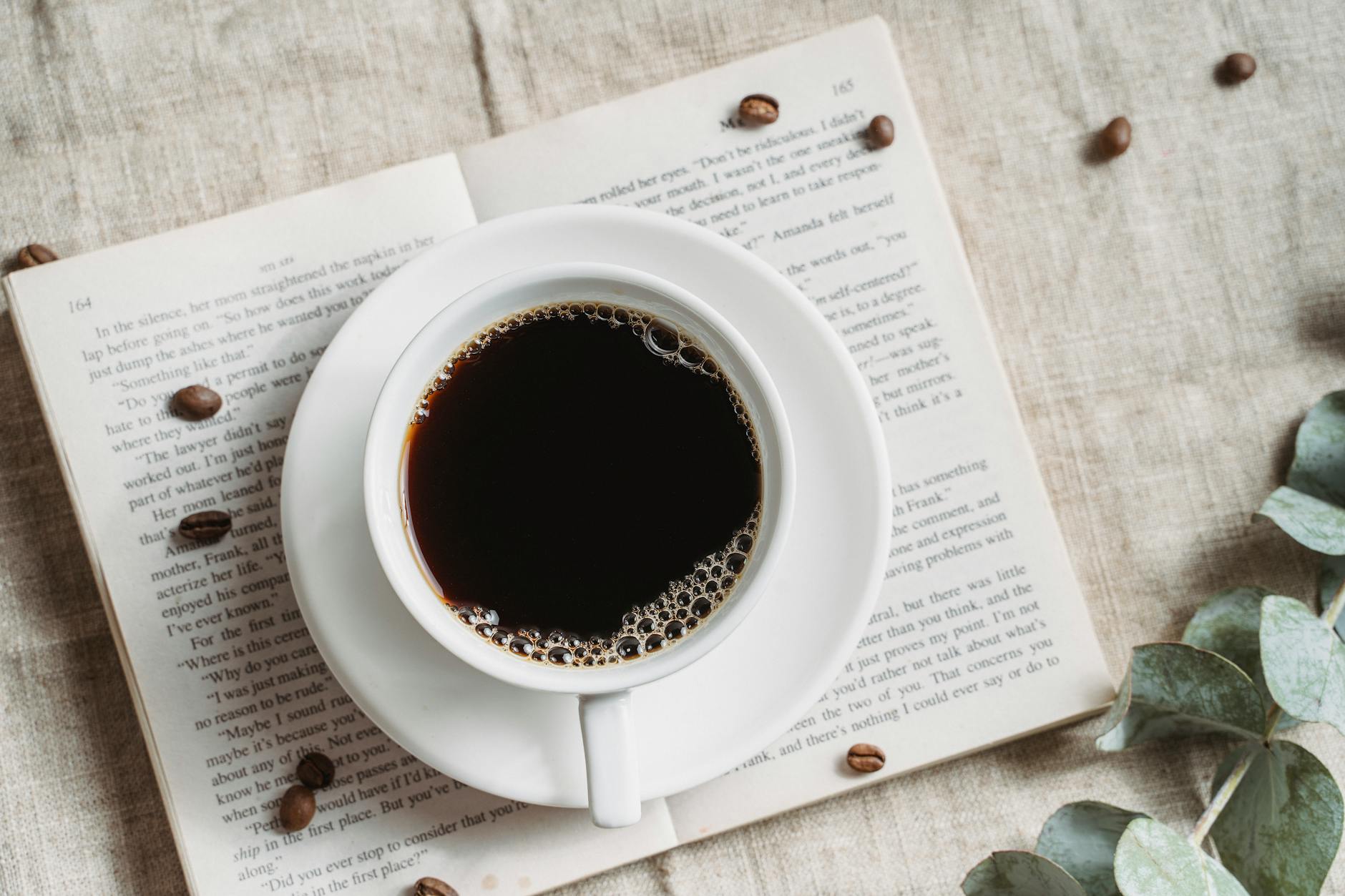 cup of espresso on book