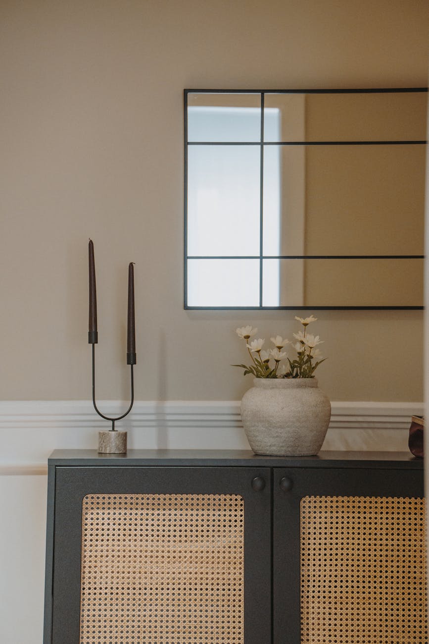 modern interior with mirror and decorative vase