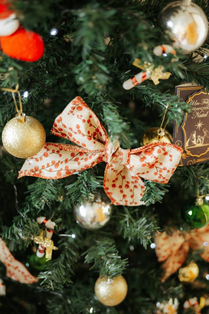 festive christmas tree with red bow and ornaments
